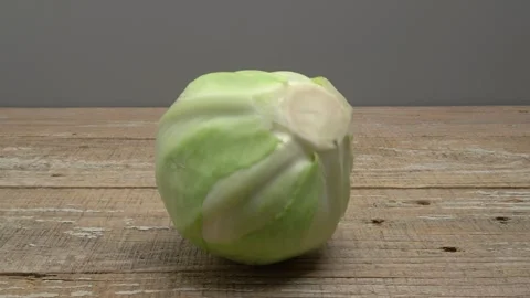 White cabbage rolls on a wooden surface on a gray background. Stockbeeldmateriaal 266491501