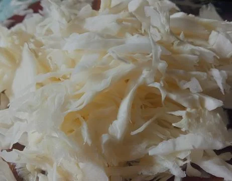 White cabbage sliced ​​thinly in the kitchen Stock Photos