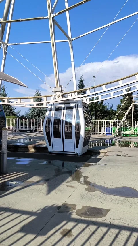 White cabin of a modern Ferris wheel against the blue sky. Stock Footage 320748798