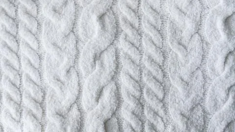 White cable knit wool sweater fabric texture close up Stock Photos