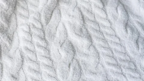 White cable knit wool sweater fabric texture close up Stock Photos