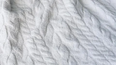 White cable knit wool sweater fabric texture close up Stock Photos