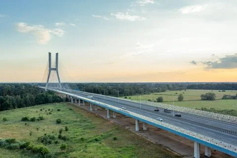 White cable-stayed bridge and highway at sunset. Redzinsky Bridge, Wroclaw,.. Stock Photos