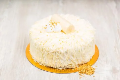 The white cake and nuts on the table Stock Photos