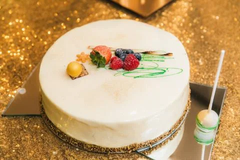 White cake with berries close up Stock Photos