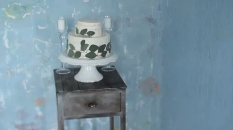 White Cake Fine Art on the Table. Fresh Leaves. Stock Footage 65660788