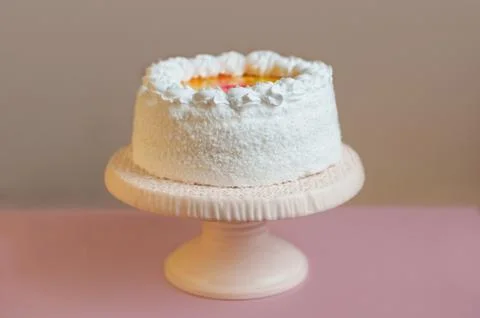 White cake on stand with gray background, horizontal Stock Photos