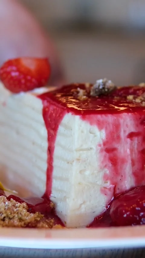 White cake with strawberry jam Close-up of a female chef stirring strawberry jam Stock Footage 293744140