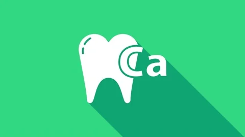 White Calcium for tooth icon isolated on green background. Tooth symbol for Stock Footage 146980090