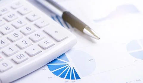 White calculator and report with chart and graph, concept of annual financi.. Stock Photos