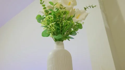 White Calla lily and eucalyptus bouquet in ceramic vase Stock Footage 333075322