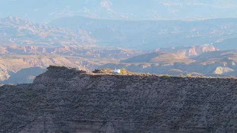 White camper van camping on a cliff in the Gorafe Desert, Spain Stock Footage 334573685