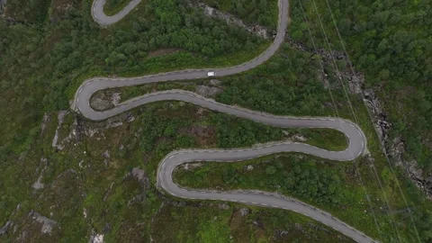 White camper van driving on serpentine road in norway Stock Footage 317433700