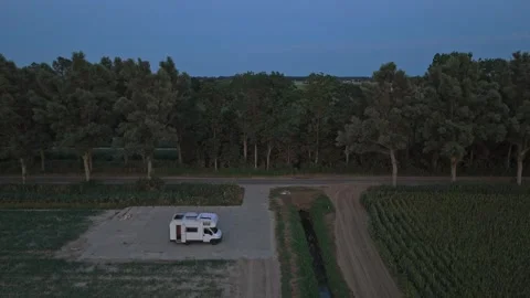 White camper van parked in the dutch countryside at twilight Stock Footage 341876070