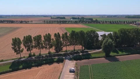 White camper van Parked on road through picturesque dutch agricultural fields 스톡 동영상 345027328