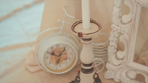 White Candel and Clock Vintage Pastel Colors Stock Footage 68689608