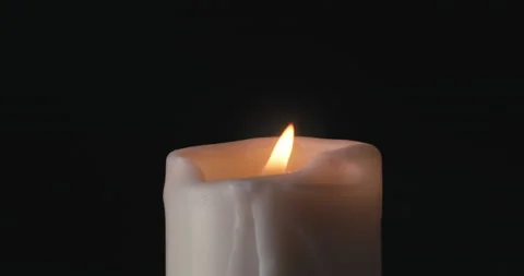 White candle on black background Stock Footage 142236780