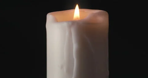 White candle on black background Stock Footage 142237075