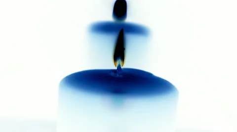 White Candle in blue Video stock 17688983