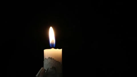 A white candle burning in the dark-5 Stock Footage 306767292