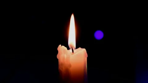 White candle burning Stock Footage 247055796