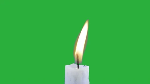 White candle burns on green screen Stock Footage 181799296