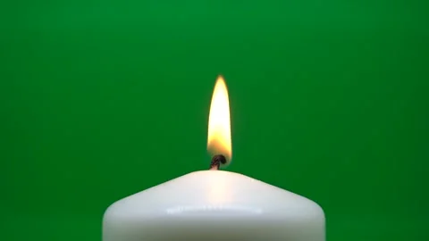 White candle burns with a warm flame Stock Footage 294426329