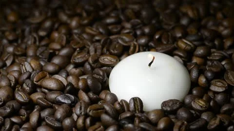 White candle on coffee beans Stock Footage 22105483