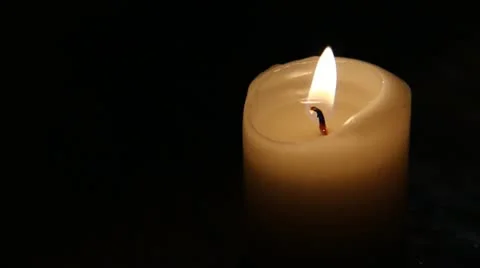 White candle in the dark Stock Footage