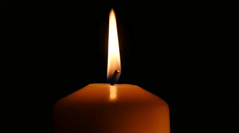 White candle in front of black background, close up, 4K. Видео 43722357