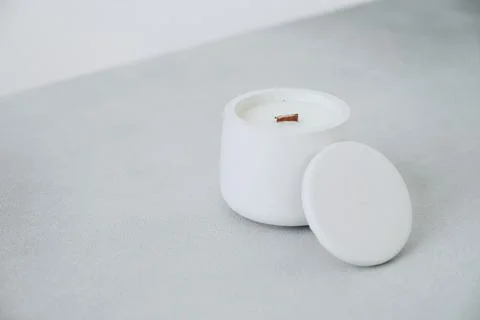 White Candle in Plaster Cache-pot, Lid is Close-up Diagonally. Place for Labe Stock Photos