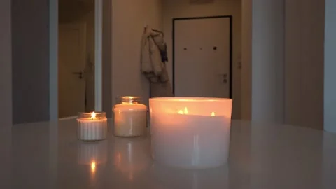 White candles in the interior. Lack of electricity. Aroma candles. Romance and Stock Footage 230482632