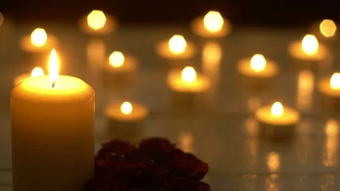White candles lights with rose on white desk, romance theme Stock Footage 80274726