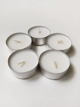 White candles on a white background Stock Photos