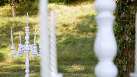 White candlesticks in the fresh air for a wedding ceremony. Decor 스톡 동영상 77209426