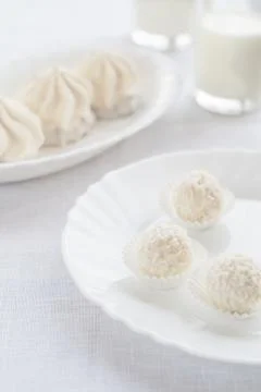 White candy and cake on a light background Foto stock