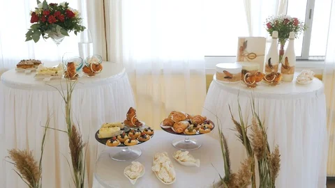 White Candy Bar Wedding, wedding pastries on sweet table candy buffet. Champagne Stock Footage 124066970