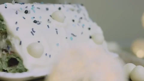 White candy spheres arranged around the decorated cake Stock Footage 342129460