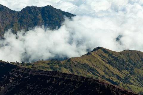 White canvas of clouds float between the mountains. Mount Rinjani, Lombok Stock Photos