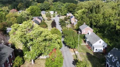 White Cape Cod Homes and Brick Colonials From Above 库存影片 347324856