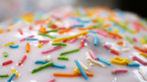 White caps of Easter cakes covered with colored powder. Stock footage Video stock 108948352
