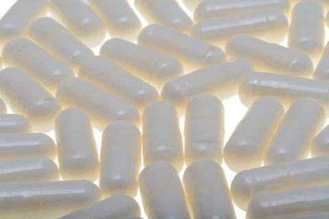 White capsules isolated Stock Photos