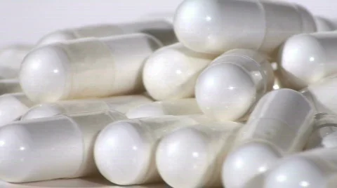 White capsules loop - HD  Stock Footage 352330