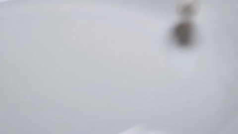 White capsules of the medication is falling down Stock Footage 98131820