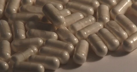 White Capsules - Rotating Stock Footage 87962471