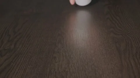White capsules spill onto the table from the jar Stock Footage 270414233