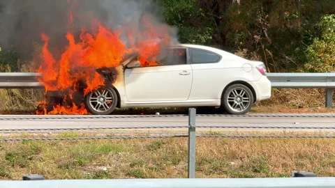 White Car Burning On Interstate Highway Stock Footage 300107142