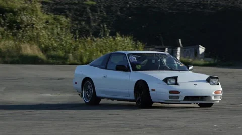 White car drifting on race track in slow motion. Stock Footage 59746825