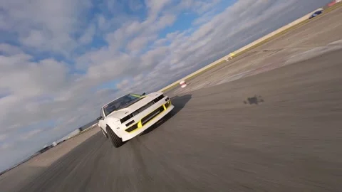 White Car Drifts with Dynamic FPV Front and Side Shots Stock Footage 325449947