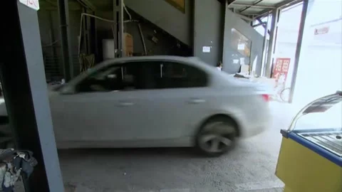 A white car driving Stock Footage 235276658